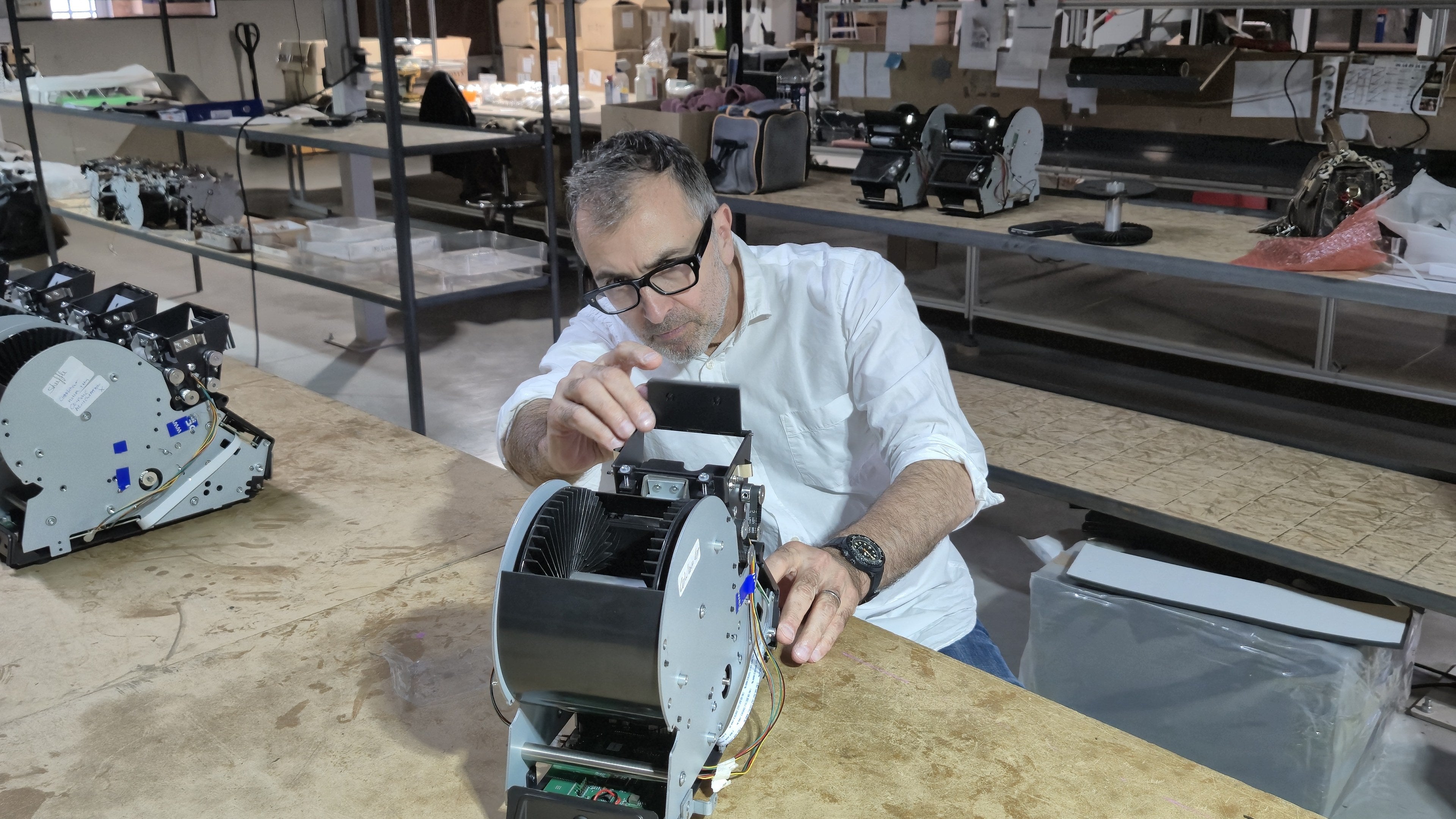 François at his workbench with a LeShuffler in front of him